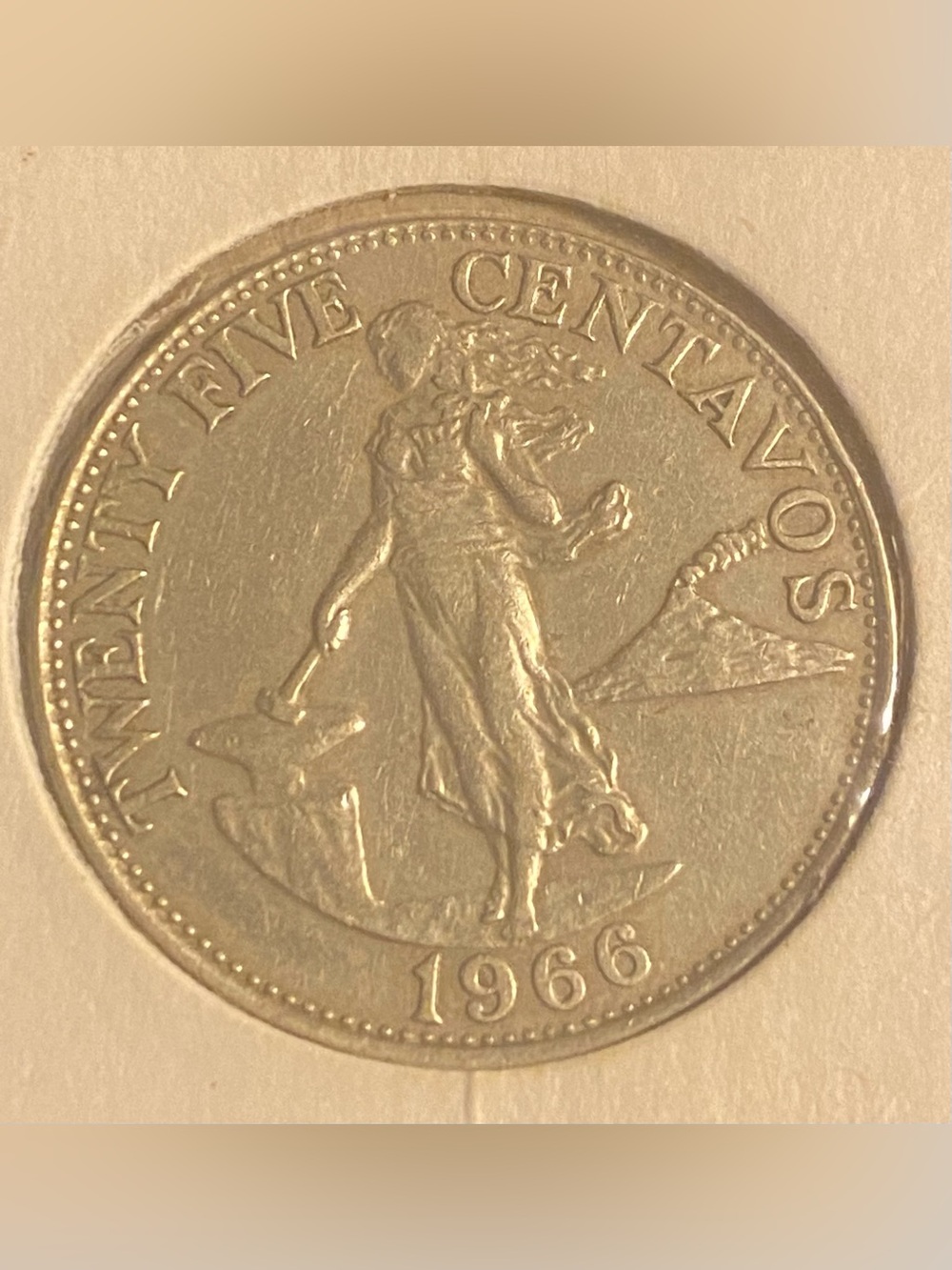 1966 Philippines Twenty-Five Centavos coin, featuring a woman standing….